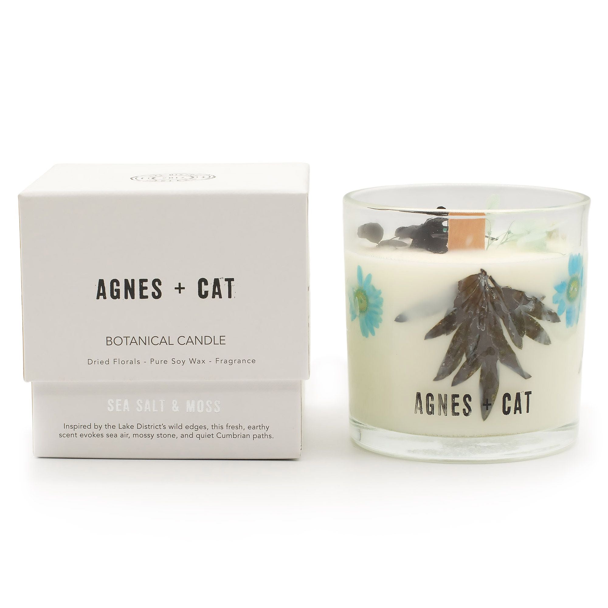 Agnes + Cat botanical candle with packaging on a white background